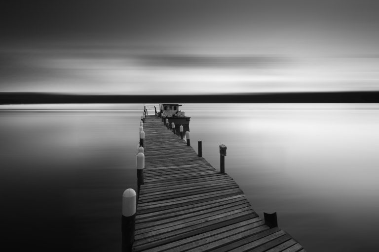 black-and-white-bridge-calm-waters-338380